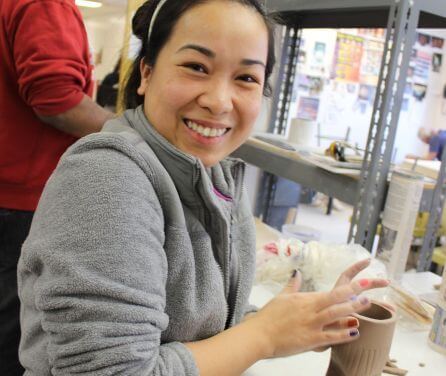 Student working with ceramics