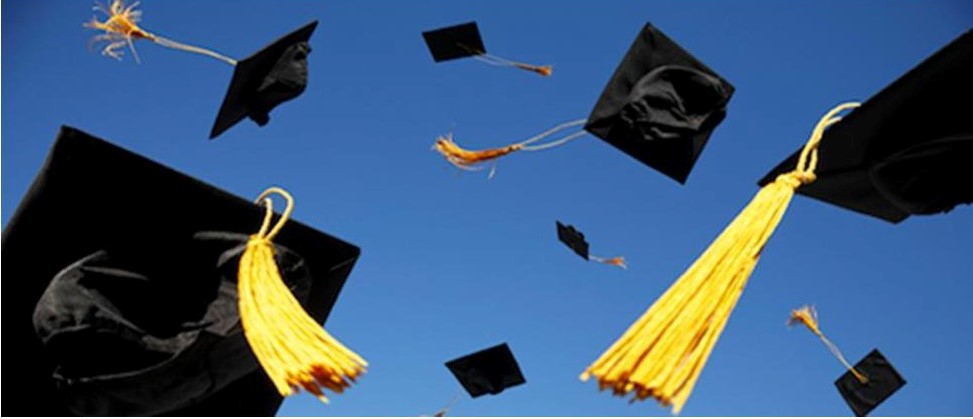 Graduation caps in the air