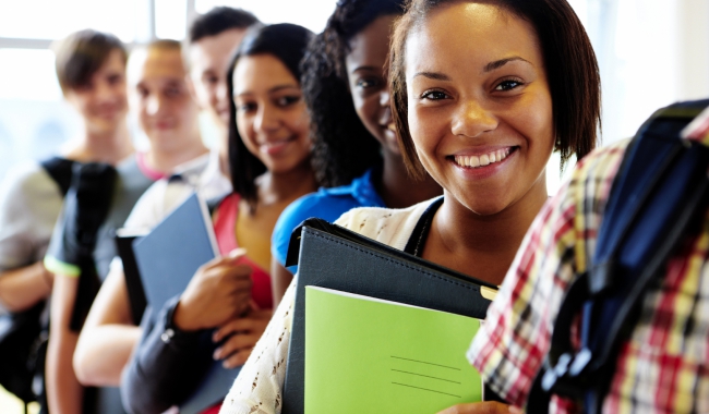 High School dual enrollment students standing in line