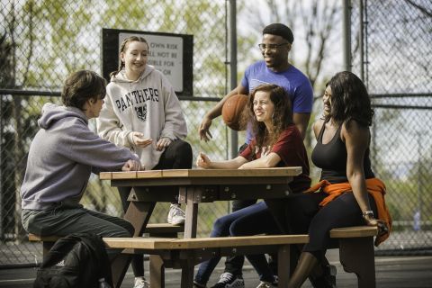 Students gathered at picnic table